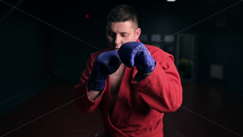 Video - Taekwondo in red kimono boxing