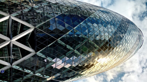 Vertical view of Timelapse The Gherkin Tower in London City district in downtown, United Kingdom - Starpik Stock