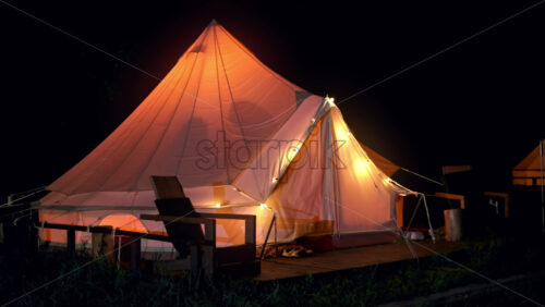 Video - Premium stock video footage - People dancing at night in a glamping court, camping and celebrating
