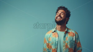 A man in colorful clothes on a blue background - Starpik