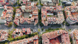 Aerial drone vertical view of Barcelona, Spain. City downtown with famous residential districts, greenery - Starpik