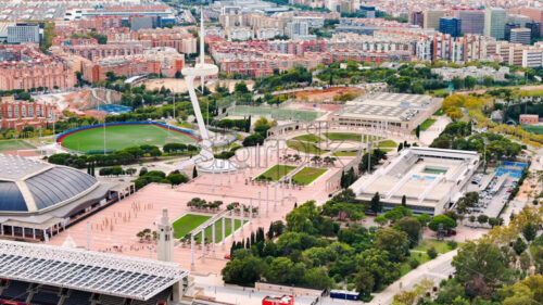 Aerial drone view of FC Barcelona football stadium. Greenery and buildings around - Starpik