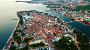 Aerial drone view of Zadar in evening, Croatia. Historical city centre with old buildings and water channels - Starpik
