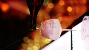 Barman making cocktails with white sparkling wine at the bar at night with red neon lights, slow motion vertical screen - Starpik