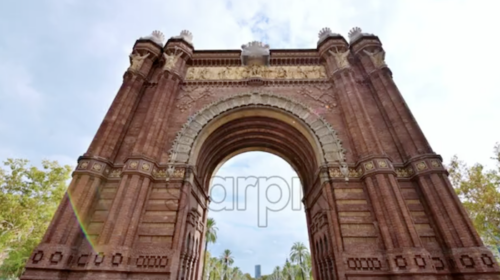 The Arc de Triomf located in Ciutadella Park in Barcelona downtown, Spain. Going through it, greenery around - Starpik