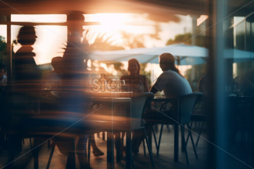 The blurred silhouettes of some people in a restaurant - Starpik