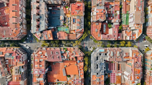 Video - Aerial drone vertical view of Barcelona, Spain. City downtown with famous residential districts, greenery