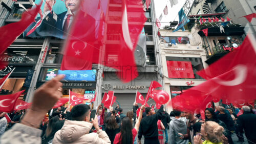 Video – Istanbul, Turkey – Multiple people waving turkish flags in city downtown at the Commemoration of Ataturk, Youth and Sport - Starpik Stock