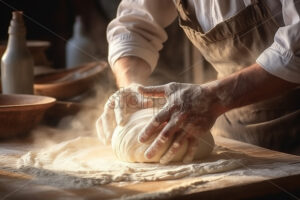 A cook mixes the dough - Starpik Stock