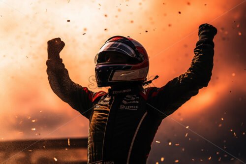 A race driver who won and raises his hands - Starpik Stock