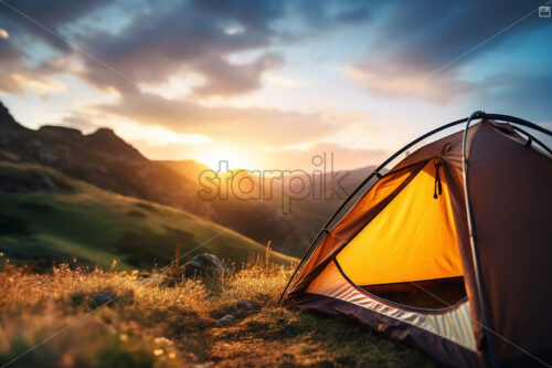 A tent on a hilltop in the background an extraordinary view - Starpik Stock