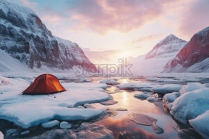 A tent on the shore of a frozen glacial lake - Starpik Stock
