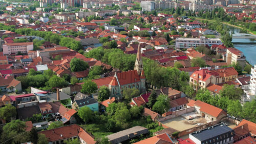 Aerial drone view of Oradea downtown, Romania. Cityscape with multiple residential buildings made in classic style - Starpik Stock