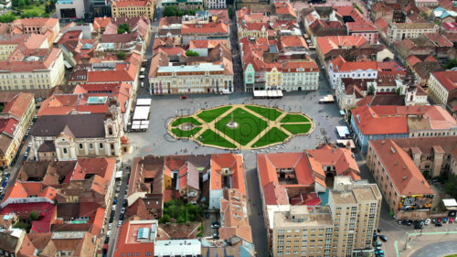 Aerial drone view of Timisoara, Romania. View of the city downtown, Unirii Square with people and multiple historical buildings around - Starpik Stock