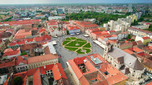 Aerial drone view of Timisoara, Romania. View of the city downtown, Unirii Square with people and multiple historical buildings around - Starpik Stock