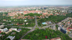 Aerial drone view of Timisoara, Romania. View of the city downtown, multiple historical and residential buildings, greenery - Starpik Stock
