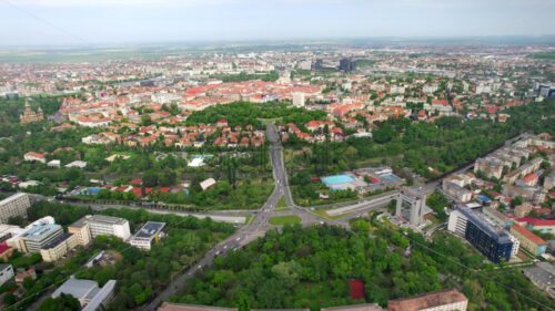 Aerial drone view of Timisoara, Romania. View of the city downtown, multiple historical and residential buildings, greenery - Starpik Stock