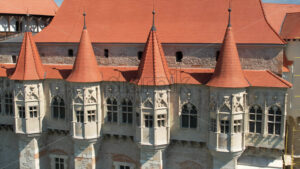 Aerial drone view of the Corvin Castle facade located in Hunedoara, Romania - Starpik Stock