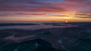 Aerial timelapse drone view of sunrise in Ceahlau National Park, Romania - Starpik Stock