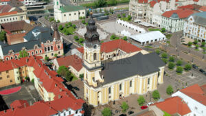 Areal drone view of the Cathedral of St. Nicholas in Oradea downtown, Romania. Unirii Square on the background - Starpik Stock