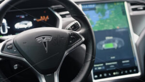 CHISINAU, MOLDOVA – JANUARY, 2022: Tesla Model S P90 interior. Big display with charging and consumption information, steering wheel - Starpik Stock