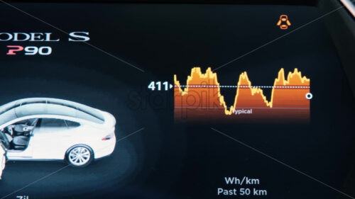 CHISINAU, MOLDOVA – JANUARY, 2022: Tesla Model S P90 interior. Display showing consumption information - Starpik