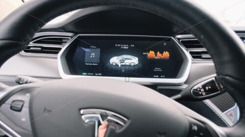 CHISINAU, MOLDOVA – JANUARY, 2022: Tesla Model S P90 interior. Steering wheel and display showing information - Starpik