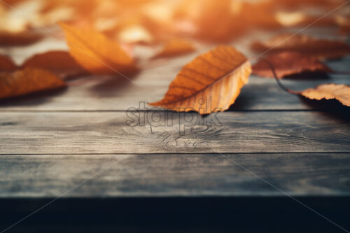 Dry yellow leaves on a wooden table - Starpik Stock