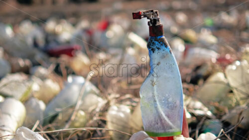 Ground with a lot of scattered plastic bottles - Starpik