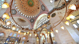 Interior view of the Suleymaniye mosque in Istanbul, Turkey. A lot of illumination, painted ceiling - Starpik Stock