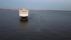 LIVERPOOL, UNITED KINGDOM – MAY 10 2023: Aerial drone vew of Seatruck cargo boat near port at sunset - Starpik Stock