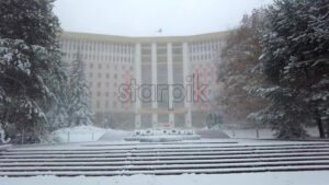 Premium stock video footage – Moldova Parliament building in winter heavy snow, Moldova slow motion cinematic - Starpik Stock