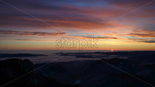 Timelapse of sunrise in Ceahlau National Park, Romania - Starpik Stock