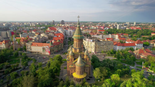 Video – Aerial drone view of Timisoara, Romania. View of the Orthodox Cathedral with historical buildings and greenery around - Starpik Stock