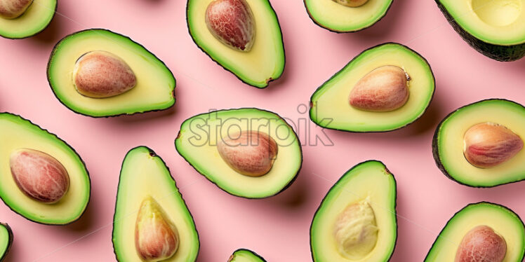 Avocado slices neatly arranged on a pink background - Starpik Stock
