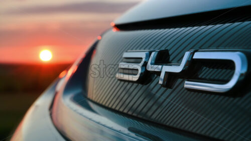 Chisinau, Moldova – April 18, 2024: Close up the back of BYD car, on the road, at sunset - Starpik Stock
