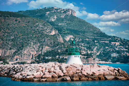 Green and white light house in Beaulieu-sur-Mer - Starpik Stock