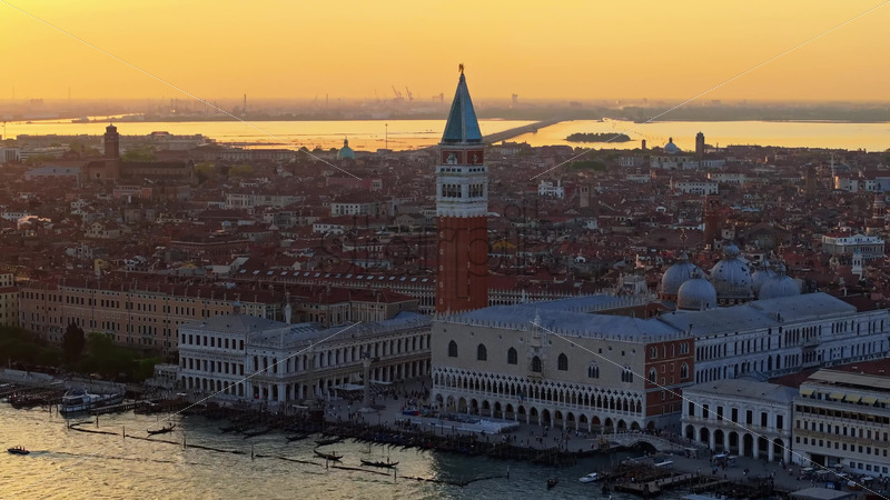 Video Aerial drone view of Doge's Palace in St. Mark's Square, near a harbour in Venice City, Italy, at sunset
