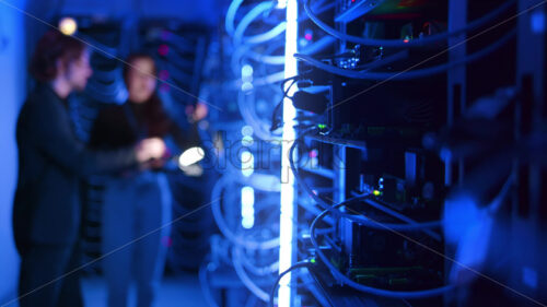 Video – Royalty free stock video A man and a woman programming in a server room - Starpik Stock