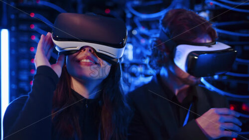 Video – Royalty free stock video A man and a woman using Virtual Reality headsets in a server room - Starpik Stock