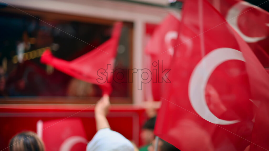 Video – 8K Video Multiple people waving turkish flags in city downtown at the Commemoration of Ataturk, Youth and Sports Day in Istanbul, Turkey. Slow motion, Download royalty free stock footage - Starpik Stock