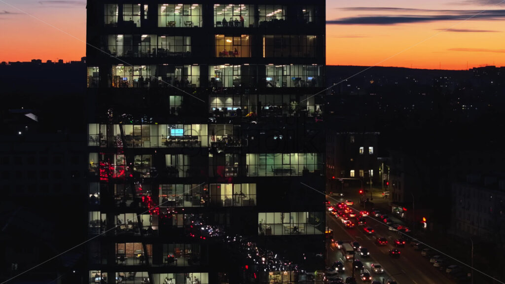 Video Aerial drone view of a glass building in Chisinau, business people working at the office, Moldova at sunset - Starpik Stock