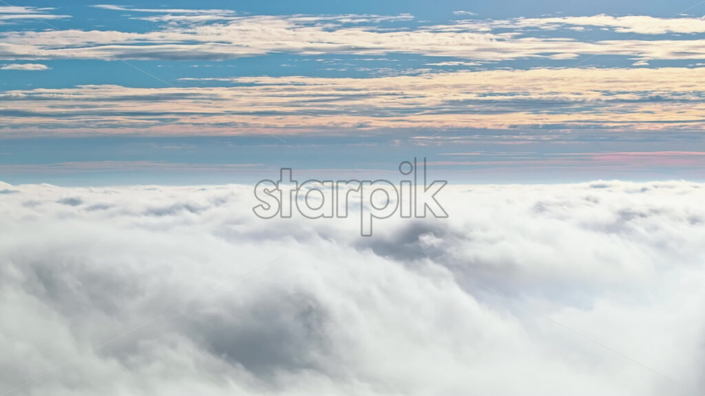 Video Aerial drone view of an utility pole in the clouds - Starpik