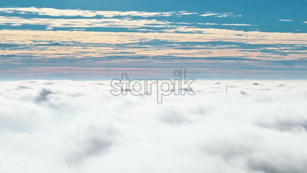 Video Aerial drone view of an utility pole in the clouds - Starpik