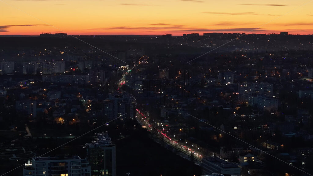 Video Aerial drone view of cars in traffic at a roundabout in Chisinau, Moldova at sunset time lapse - Starpik