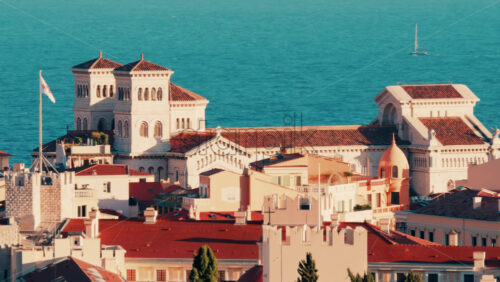 Video Distant aerial view of the Prince's Palace in the skyline of Monaco with the sea on the background