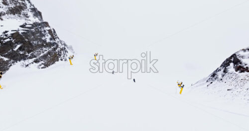 Aerial drone view of Portavescovo covered in snow, in Arabba, Italy - Starpik Stock