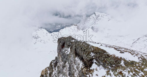 Aerial drone view of Portavescovo covered in snow, in Arabba, Italy - Starpik Stock