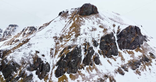 Aerial drone view of Portavescovo covered in snow, in Arabba, Italy - Starpik Stock
