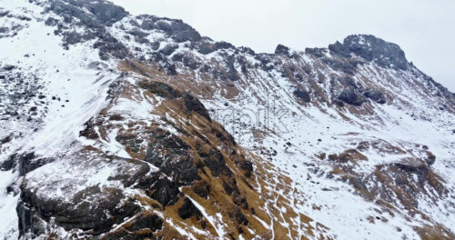 Aerial drone view of Portavescovo covered in snow, in Arabba, Italy - Starpik Stock